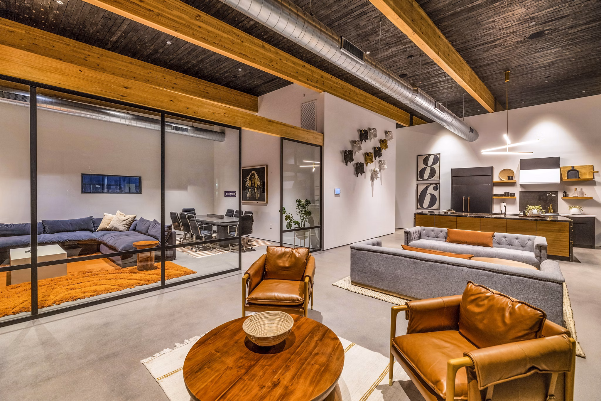 Clubhouse featuring modern design and spacious seating at The Premiere at Eastmark Apartments