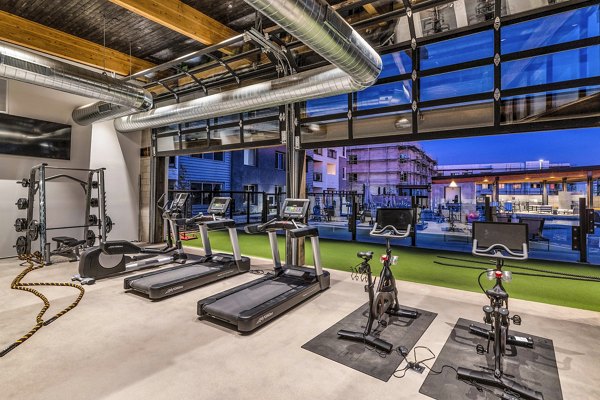 State-of-the-art fitness center at The Premiere at Eastmark Apartments, featuring modern equipment and spacious workout areas