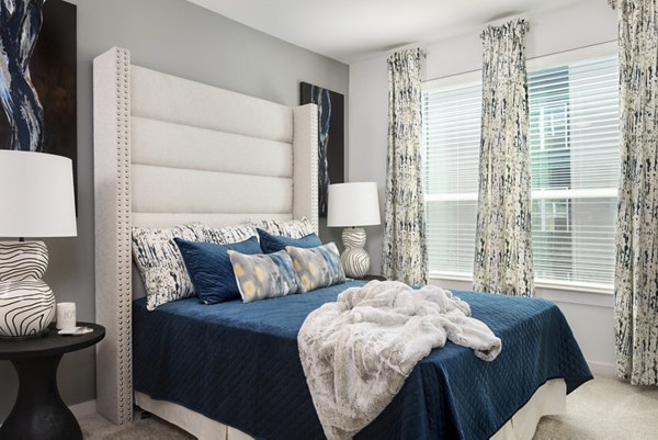 Cozy bedroom with elegant furnishings at Parkside at Round Rock Apartments