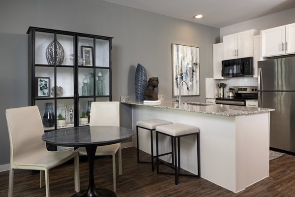 Modern dining area with elegant lighting in Parkside at Round Rock Apartments, showcasing contemporary luxury living spaces