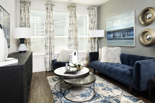 Spacious living room with modern furnishings in Parkside at Round Rock Apartments