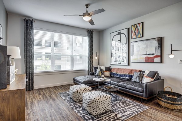 Spacious living room with modern decor in Parkside at Round Rock Apartments