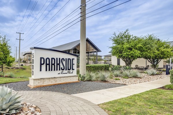 Welcome signage at Parkside at Round Rock Apartments featuring luxury living amenities