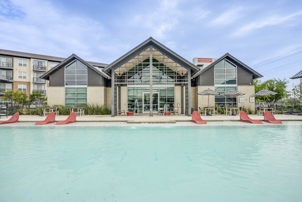 Sun-drenched pool at Parkside at Round Rock Apartments offering luxury relaxation and leisure amenities