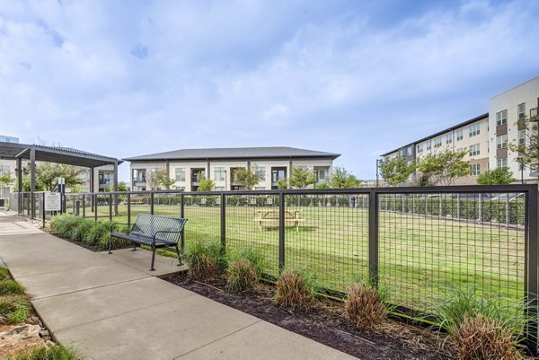 Playground area at Parkside at Round Rock Apartments featuring modern equipment and safe play surfaces for children