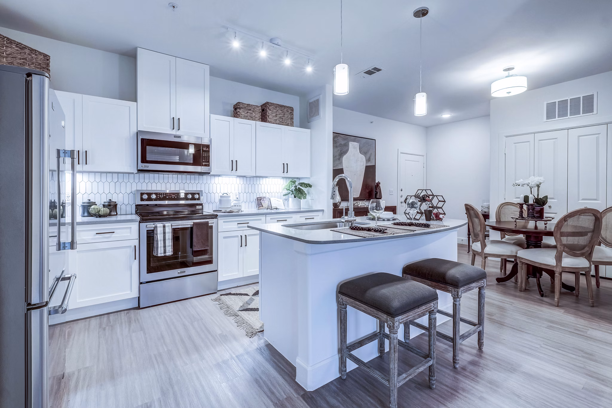 Modern kitchen with stainless steel appliances at Vineyard Apartments luxury living spaces