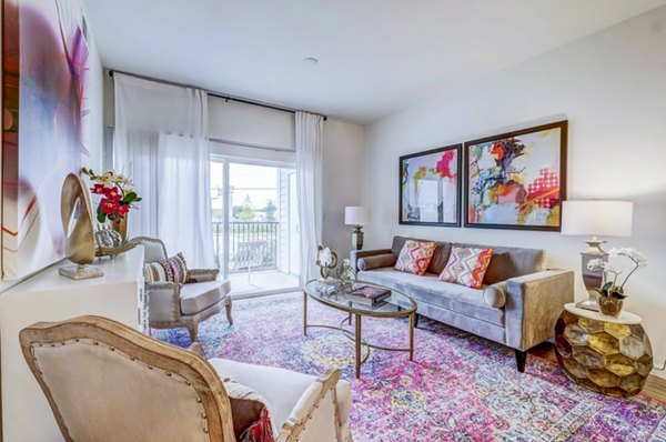 Bright living room with modern furnishings at Vineyard Apartments, featuring elegant decor and ample natural light