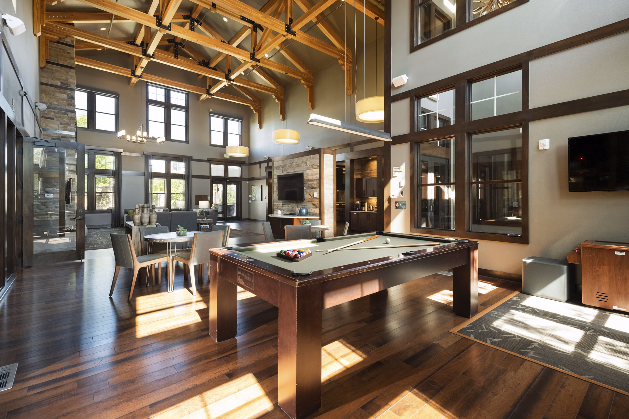 Clubhouse featuring modern decor and communal seating at The Trails at Timberline Apartments, luxury living with premium amenities