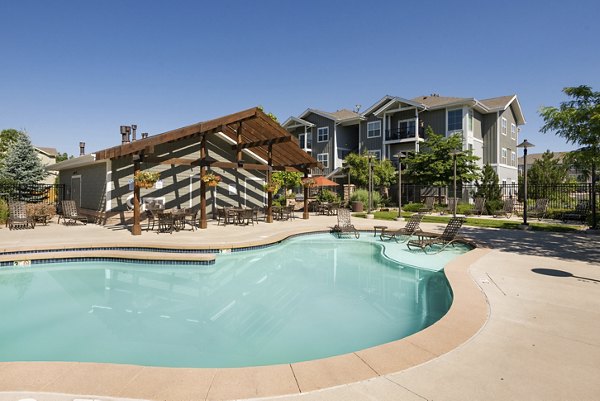 Resort-style pool with sundeck at The Trails at Timberline Apartments, offering luxury living in Fort Collins