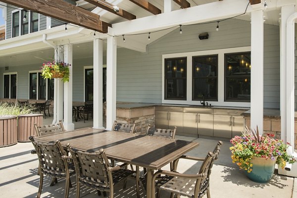 Spacious outdoor patio with seating and mountain views at The Trails at Timberline Apartments