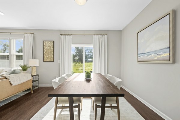 Dining area with modern furnishings at Wayford at Innovation Park Apartments