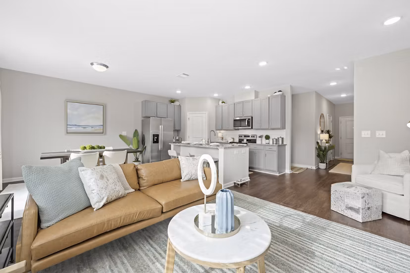 Living room with modern furnishings at Wayford at Innovation Park Apartments, a Greystar luxury community