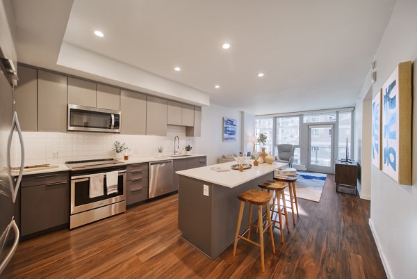 Shoreline Gateway Apartments: Modern kitchen with stainless steel appliances and quartz countertops