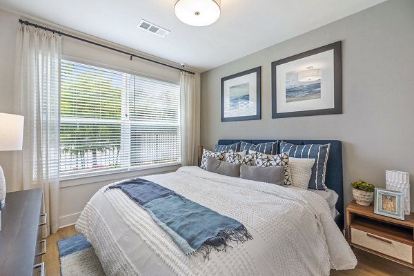 Luxurious bedroom featuring elegant decor at Ltd Med Center Apartments