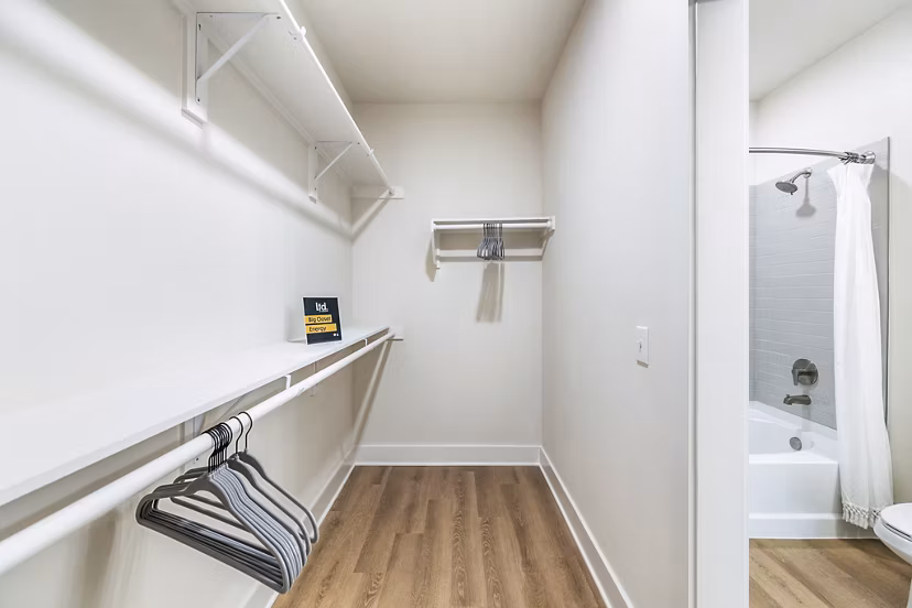 Bedroom closet featuring ample storage space and built-in lighting at Ltd Med Center Apartments