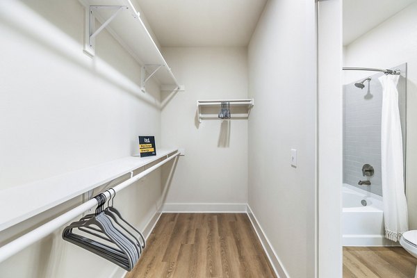 Bedroom closet featuring ample storage space and built-in lighting at Ltd Med Center Apartments