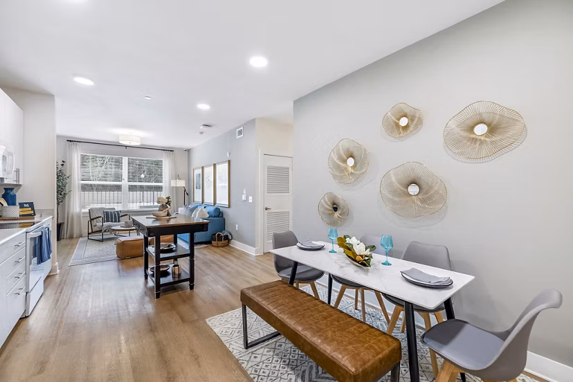 Dining room with elegant chandelier and modern furnishings at Waterford Place Apartments