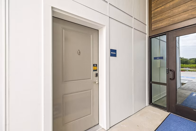 Residents entry at Ltd Med Center Apartments: Elegant entrance with lush landscaping and modern design in Houston
