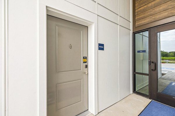 Residents entry at Ltd Med Center Apartments: Elegant entrance with lush landscaping and modern design in Houston