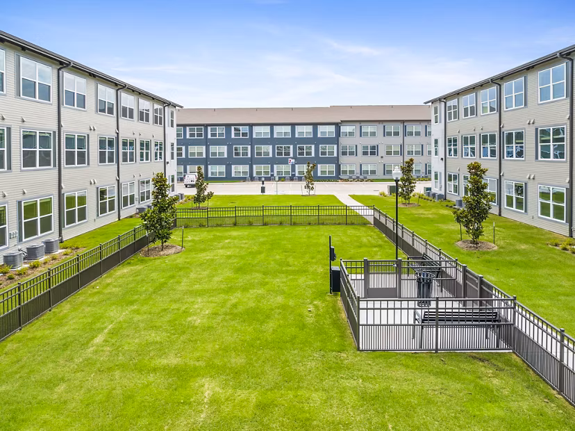 Dog park with agility training area at Ltd Med Center Apartments