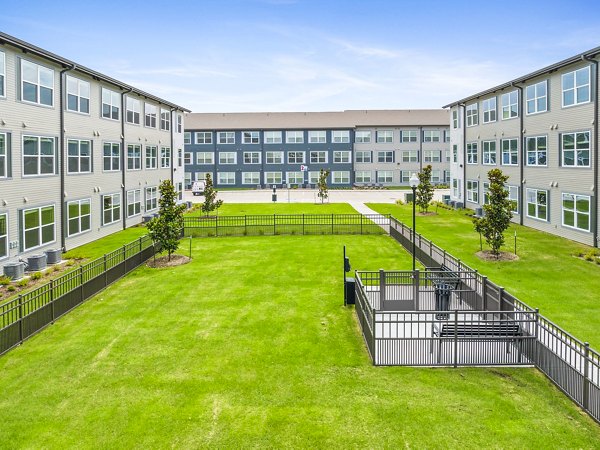 Dog park with agility training area at Ltd Med Center Apartments