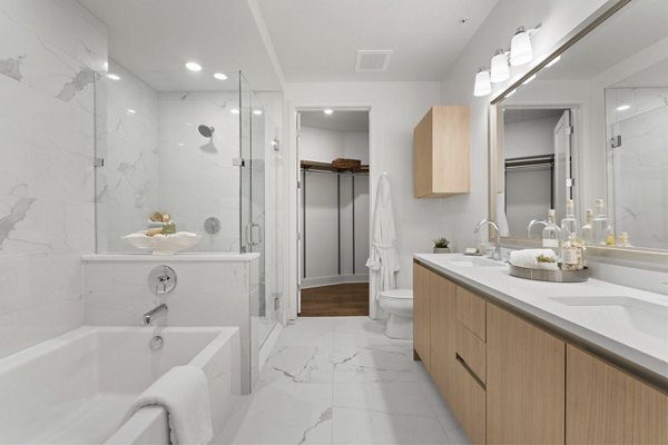 Bathroom with modern fixtures and elegant marble countertops in Stanza Little Italy Apartments