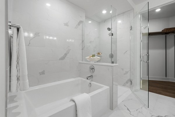 Modern bathroom with sleek fixtures at Stanza Little Italy Apartments