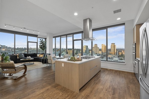 Modern kitchen with stainless steel appliances at Stanza Little Italy Apartments, offering luxury living in a prime location