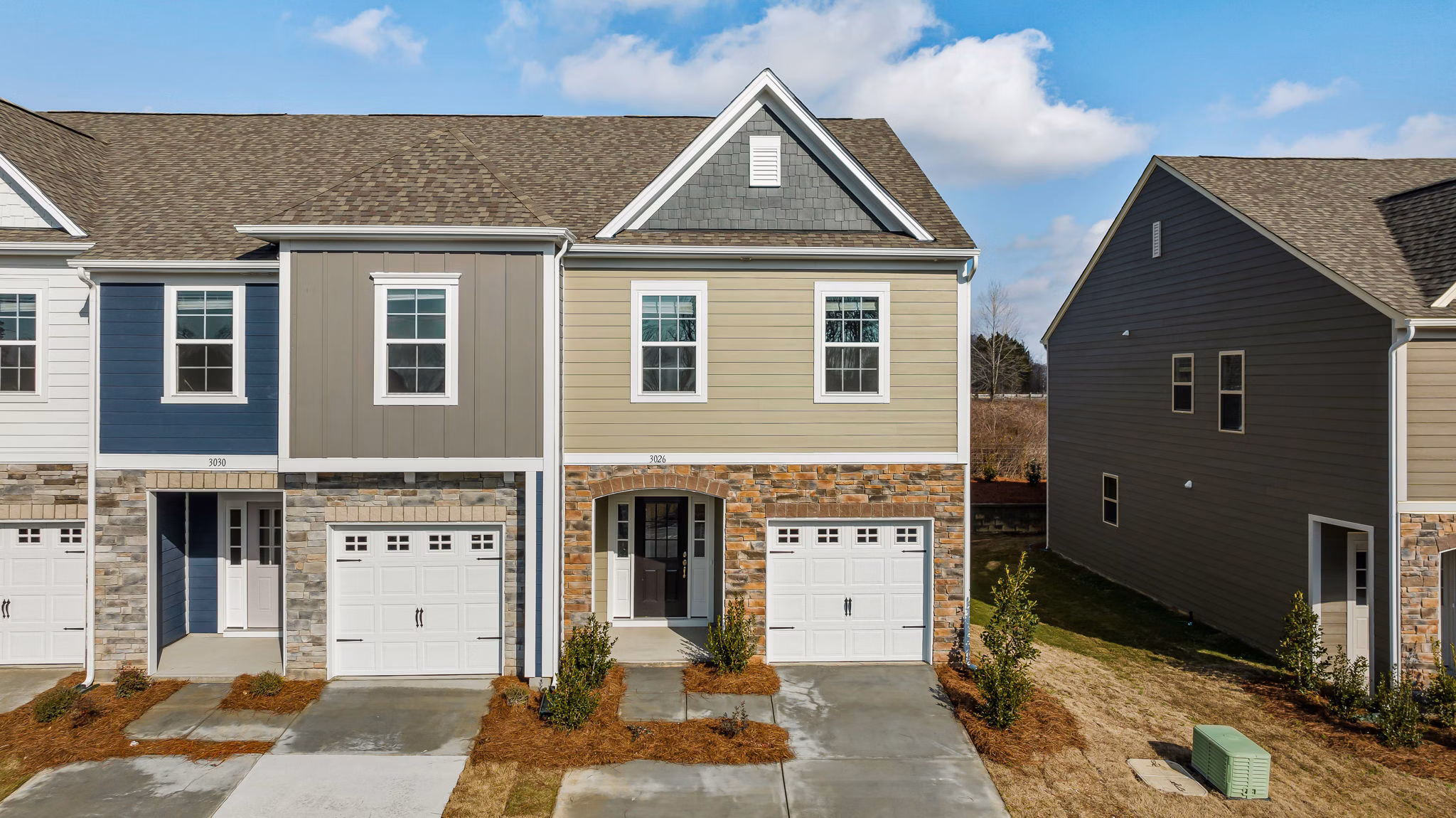 ABODE at Parkside: Contemporary apartment townhomes with landscaped surrounds