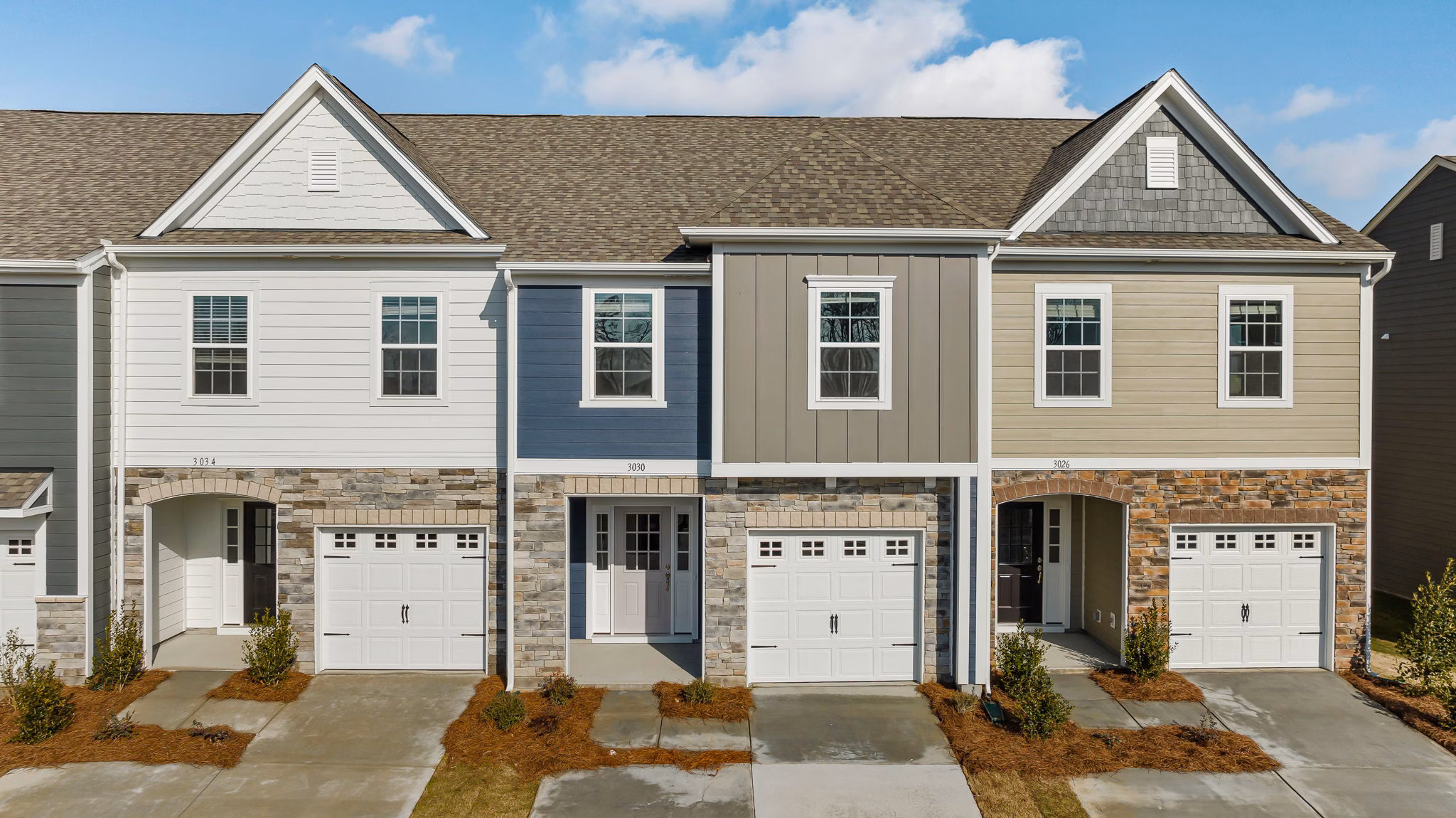 ABODE at Parkside: Elegant apartment townhomes with lush landscaping in a peaceful neighborhood
