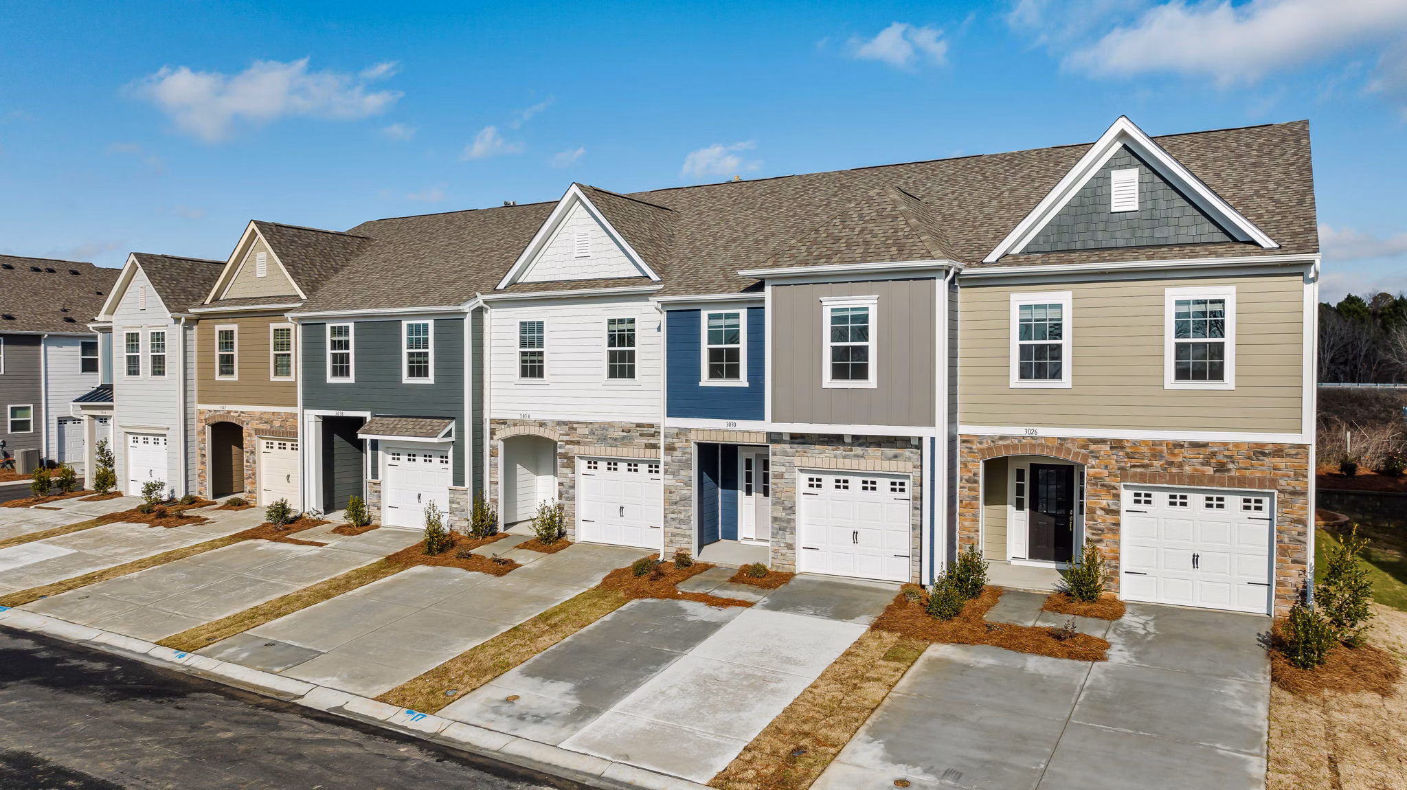 ABODE at Parkside Apartment Townhomes: Modern apartment building with landscaped gardens