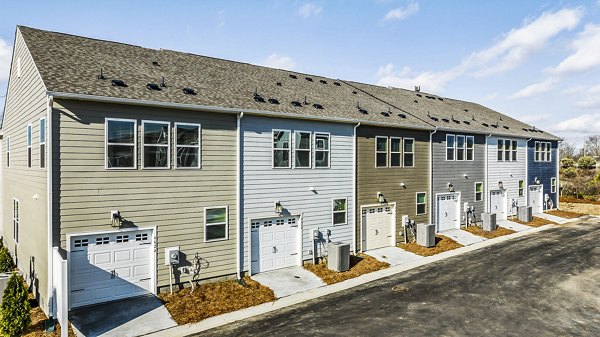 building/exterior and garage at ABODE at Parkside Apartment Townhomes