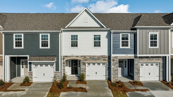 ABODE at Parkside: Modern townhome community with lush landscaping