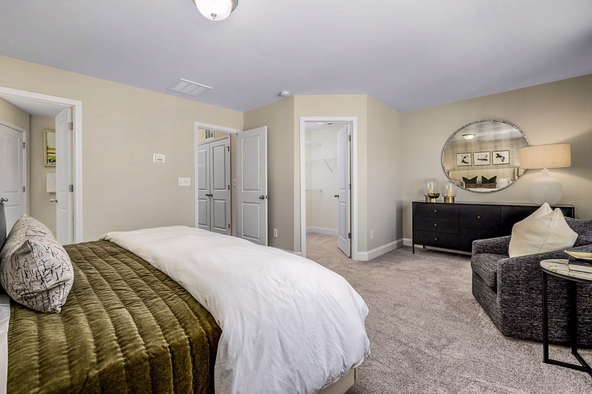 Cozy bedroom with modern decor at ABODE at Parkside Apartment Townhomes, offering luxury accommodation in urban setting