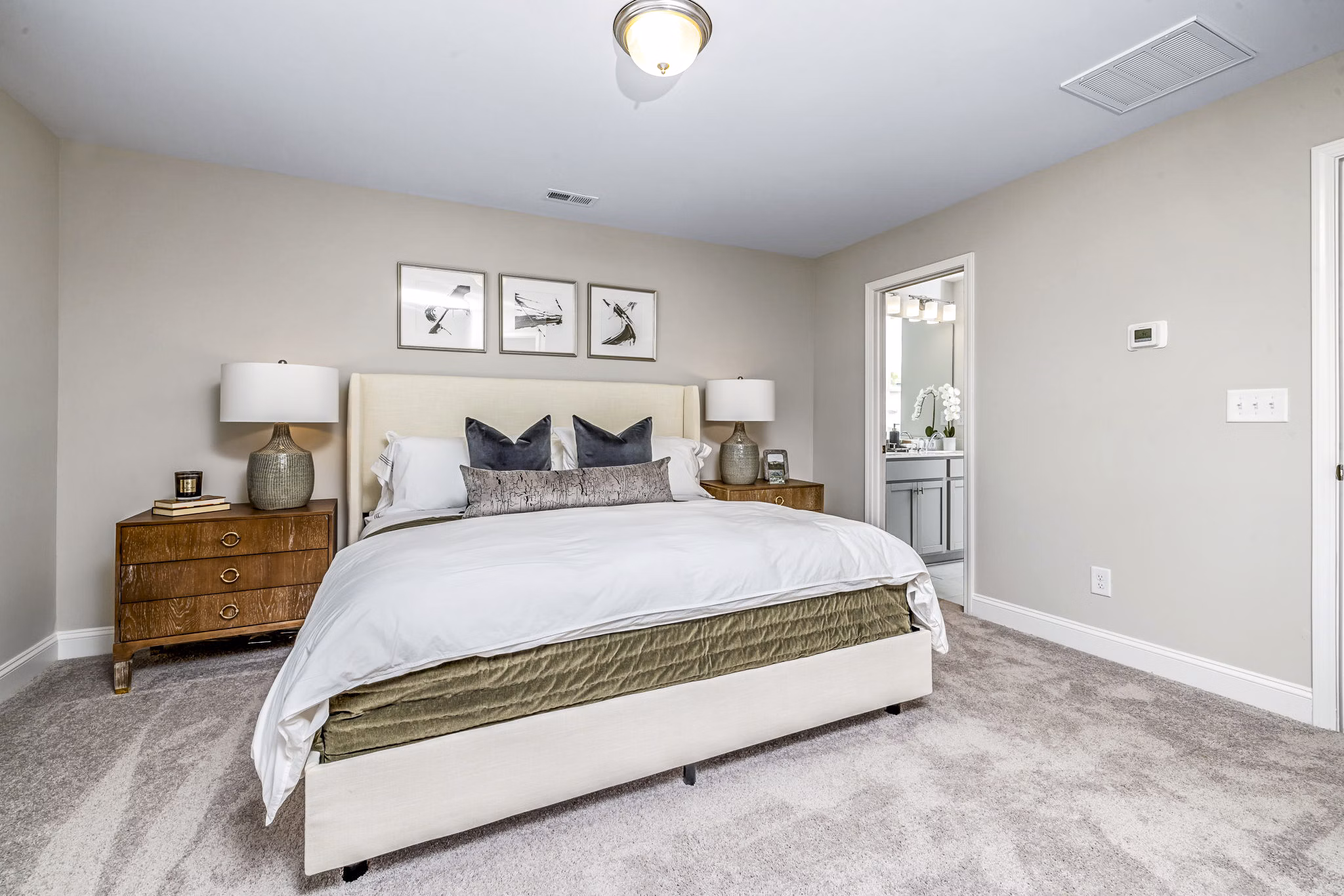 Spacious bedroom with modern furnishings at ABODE at Parkside Apartment Townhomes