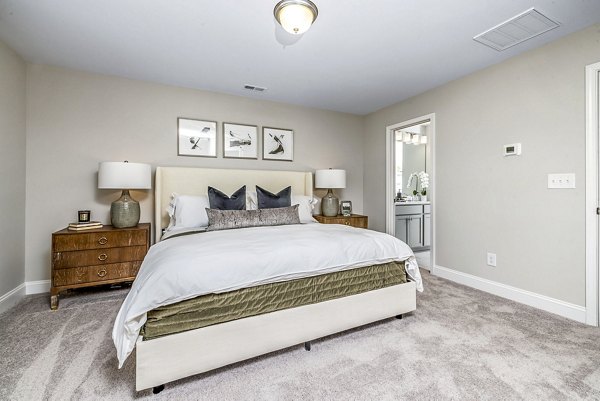 Spacious bedroom with modern furnishings at ABODE at Parkside Apartment Townhomes