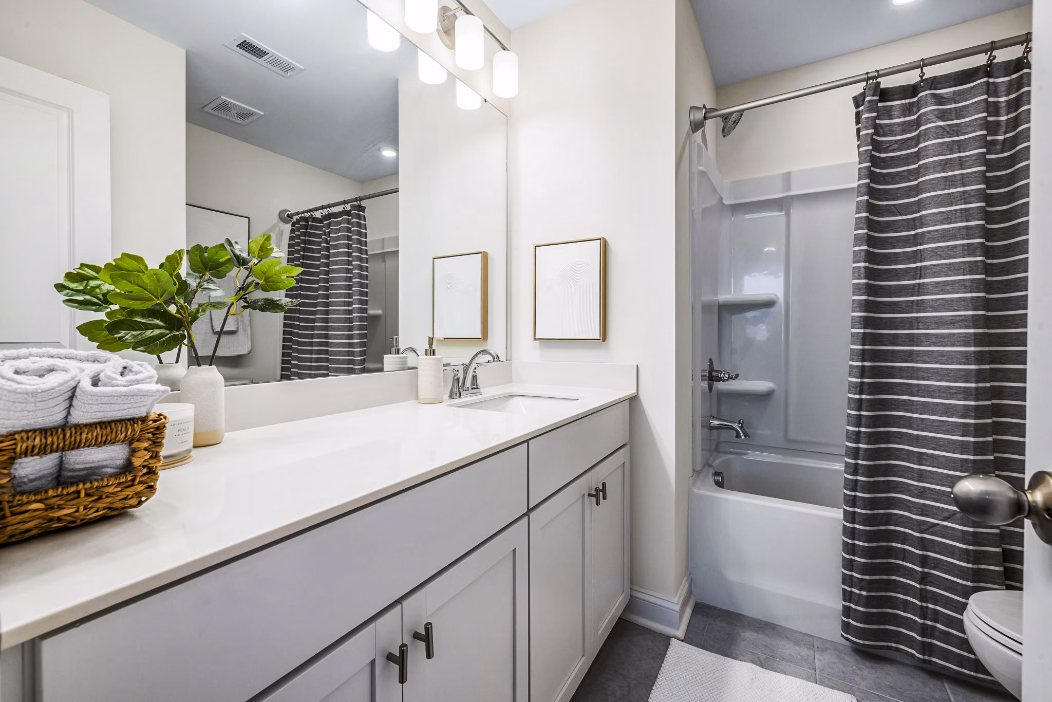 Modern bathroom featuring sleek fixtures at ABODE at Parkside Apartment Townhomes