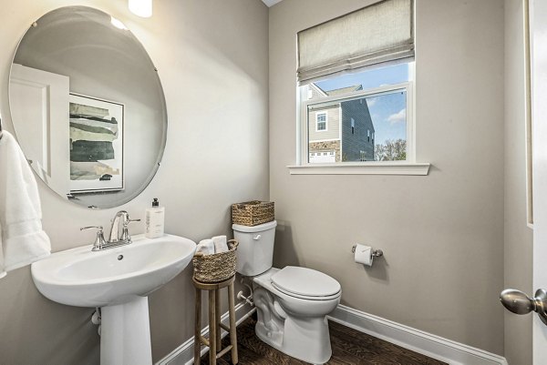 Bathroom featuring modern fixtures at ABODE at Parkside Apartment Townhomes