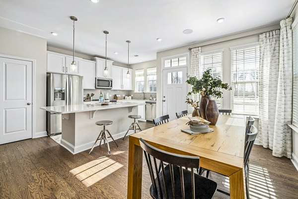 Elegant dining room with modern furnishings at ABODE at Parkside Apartment Townhomes