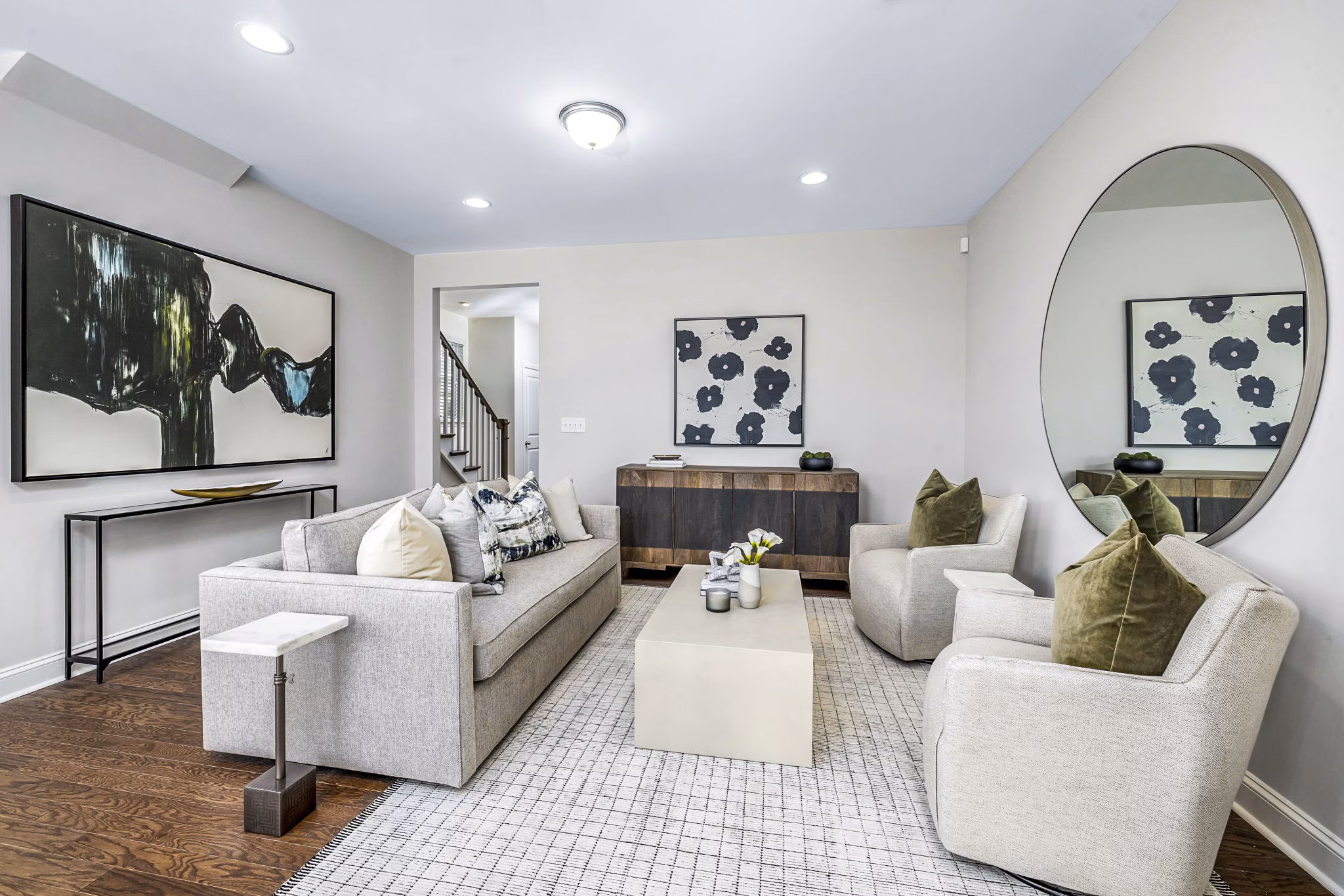 Spacious living room with modern decor in ABODE at Parkside Apartment Townhomes