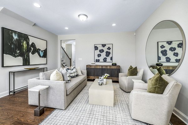 Spacious living room with modern decor in ABODE at Parkside Apartment Townhomes
