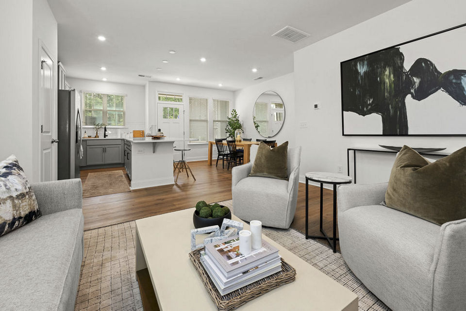 Spacious living room with modern decor in ABODE at Parkside Apartment Townhomes