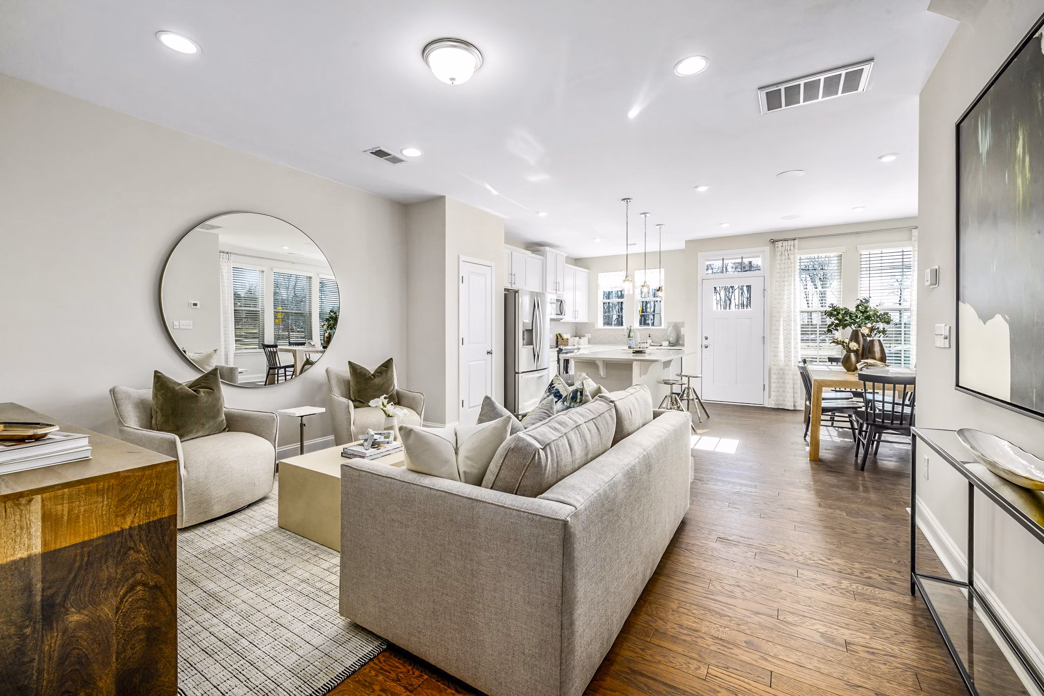 Spacious living room with modern decor in ABODE at Parkside Apartment Townhomes