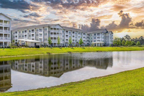 building/exterior at The Grove at Coastal Grand Apartments