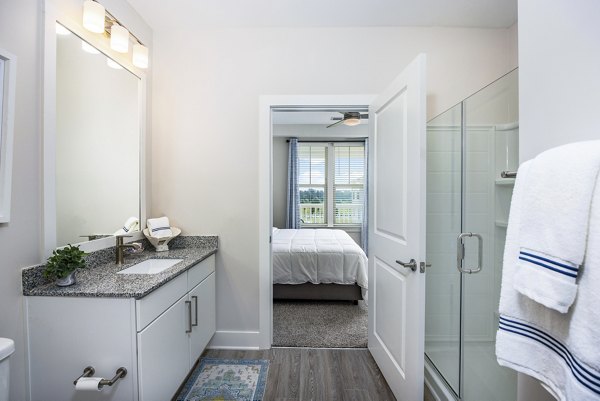 The Grove at Coastal Grand: Modern bathroom with sleek fixtures and elegant design apartment in Myrtle Beach