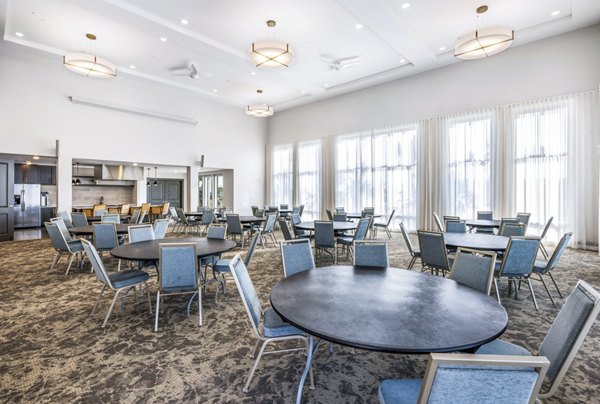 Spacious clubhouse dining room featuring modern decor at The Grove at Coastal Grand Apartments