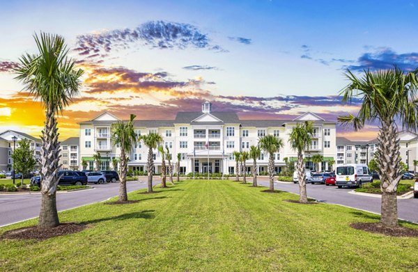 Clubhouse and leasing office at The Grove at Coastal Grand Apartments, featuring stylish interiors and modern design