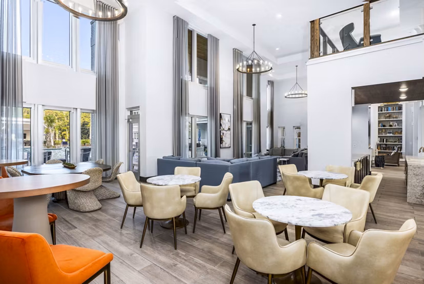 The Grove at Coastal Grand Apartments: Modern clubhouse lobby featuring elegant design