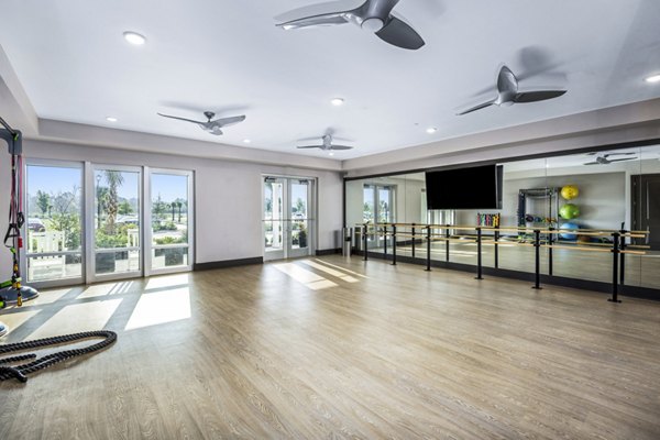 fitness center at The Grove at Coastal Grand Apartments