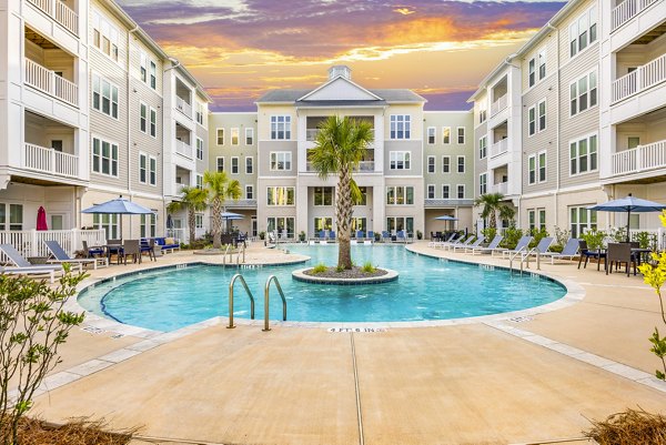 Resort-style pool at The Grove at Coastal Grand Apartments offering relaxation and luxury living